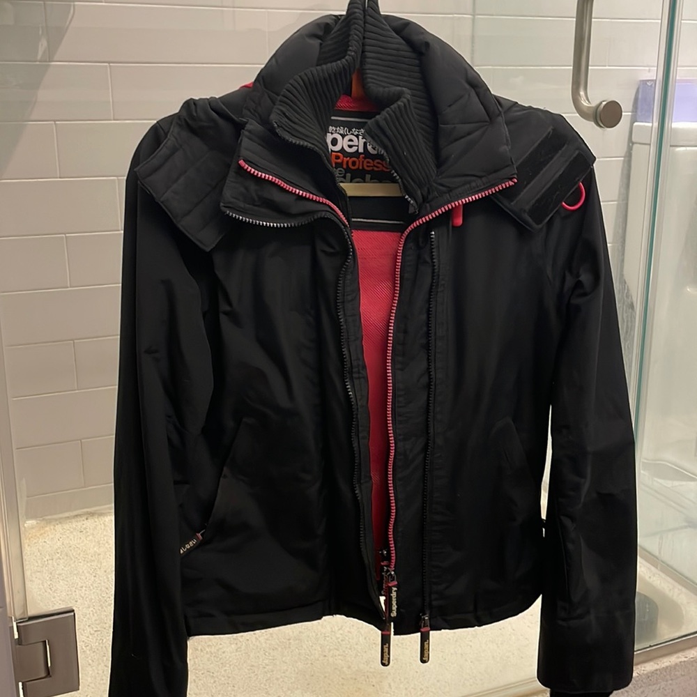 Superdry black jacket with pink interior. Excellent condition. Size XS.